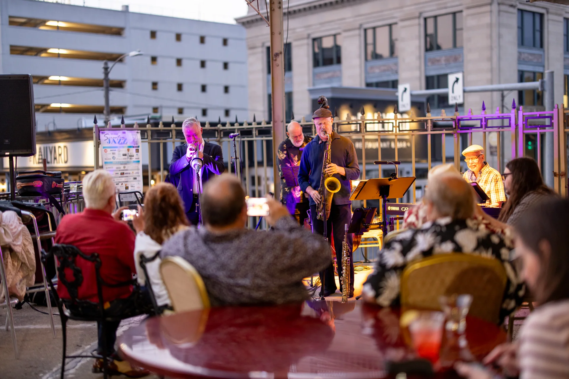 Scranton Jazz Festival performers on an outdoor stage at dusk